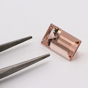 A morganite rectangular step-cut gemstone ready to be made into jewellery