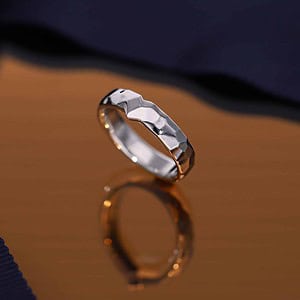 Custom-made men's wedding band with an edgy hammered look.