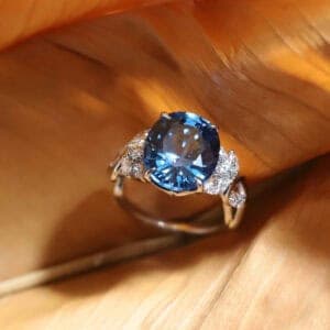 Beautiful and unique bespoke oval-shaped lagoon tourmaline engagement ring.