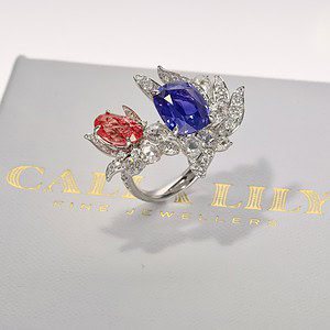 A bespoke creation, entirely unique, featuring a rare coral-hued padparadscha sapphire.