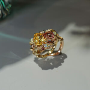 Bespoke ring with yellow sapphire and malaia garnet, sprinkled with scintillating opals and diamonds.