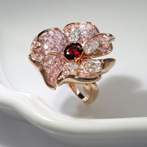 Highly coveted ruby, pink sapphires and diamonds pay homage to the wonders of nature in this delicate creation.