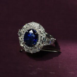 Our bespoke made blue sapphire ring with a halo of diamonds.