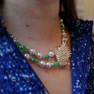 Client modelling her restyled diamond, jade and pearl necklace.