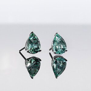 The undisputed elegance of a beautiful pair of bespoke earring studs. Lagoon tourmaline drops.