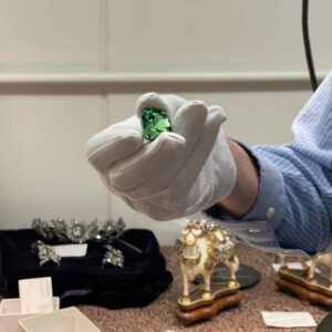 Mineralogist Jeff Post holds the Lion of Merelani gem