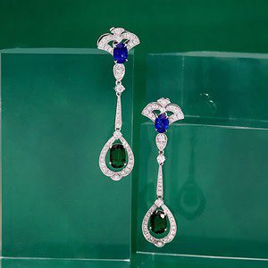 Art deco inspired customised earrings featuring Tsavorites and Sapphires.