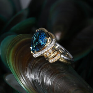 The brilliance of a blue topaz is indeed mesmerising, as seen in this custom made ring with diamonds.