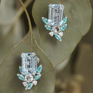 Custom-made rectangular aquamarine earring studs worn with detachable wing jackets featuring paraibas and diamonds.