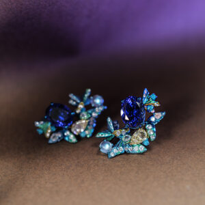 Bespoke titanium earrings with tanzanites, opals and diamonds. Titanium is very lightweight yet strong, and its surface can be anodised to portray lovely colours to complement the gemstones.