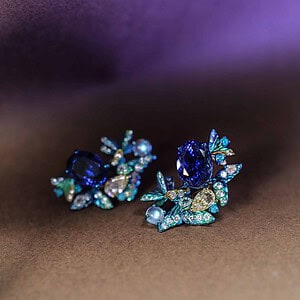 Bespoke titanium earrings with tanzanites, opals and diamonds. Titanium is very lightweight yet strong, and its surface can be anodised to portray lovely colours to complement the gemstones.