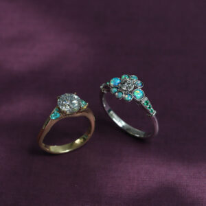 Custom-made rings with diamonds, opals, and paraibas