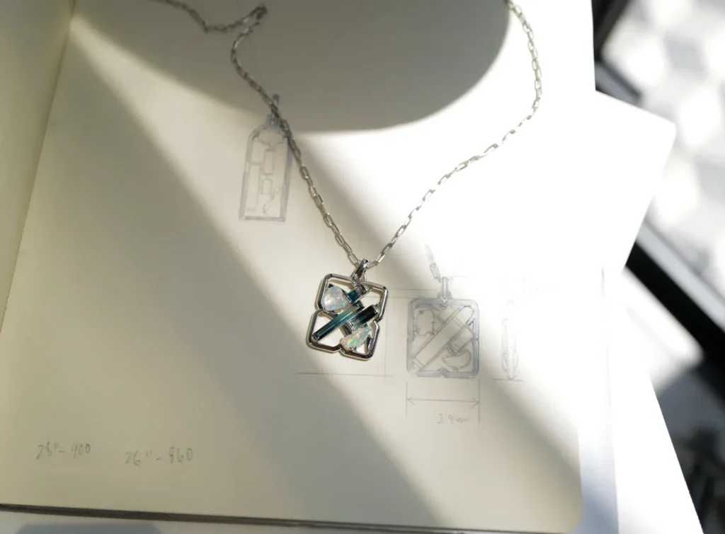 A bespoke birthday gift pairing Mexican water opals and bi colored tourmalines