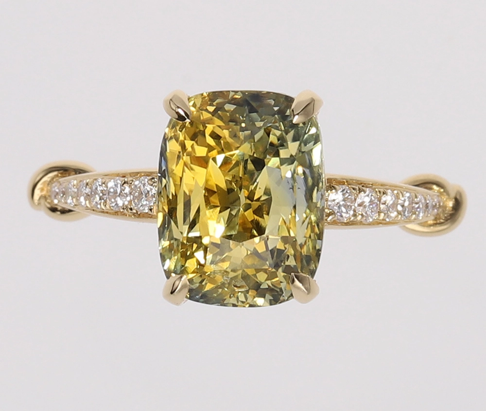 Parti sapphire, derived from the term “partite”, displays a complex blend of blue, green, and yellow