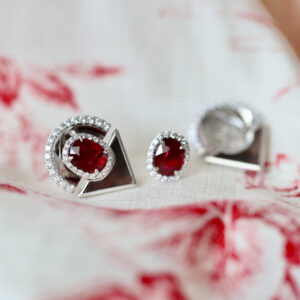Custom made ruby earrings with detachable black mother-of-pearl and diamond jackets.